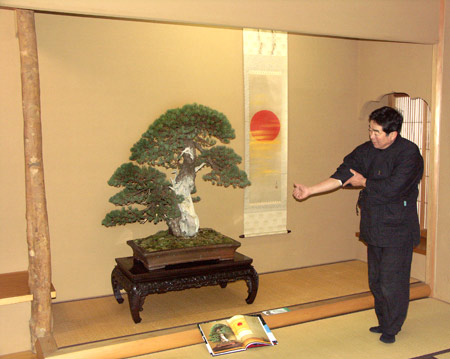 Kunio Kobayashi explaining pine bonsai