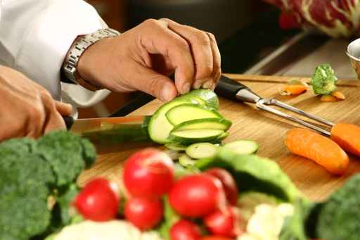 Chef cutting on a wooden board